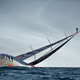 Illustration for article titled Spectacular stunt: Man runs up 98-foot ship mast and jumps into the sea